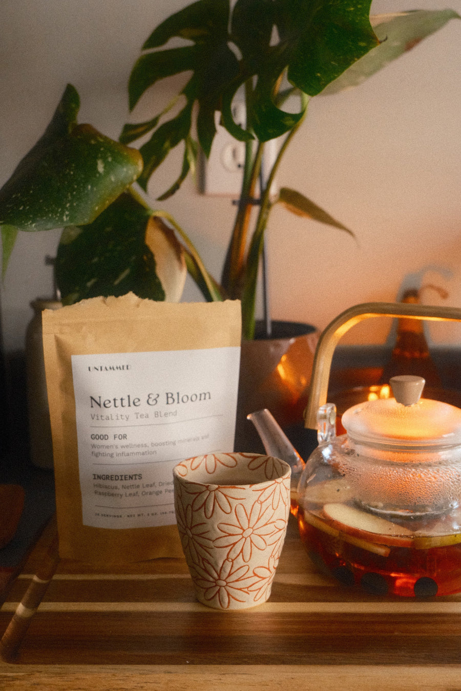 Nettle & Bloom tea steeping in a glass teapot